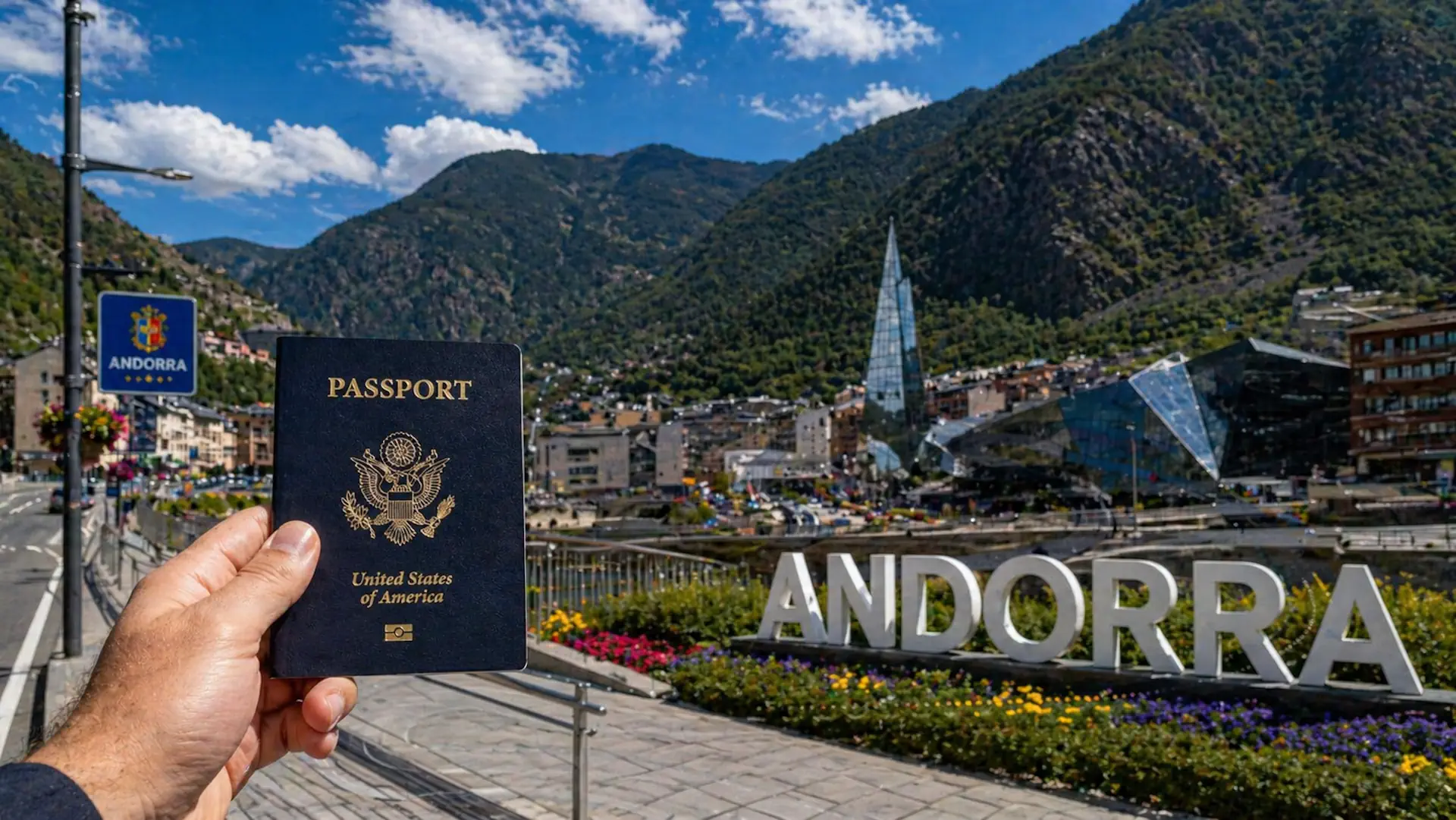 US passport held in front of Andorra la Vella with Pyrenees mountains in background