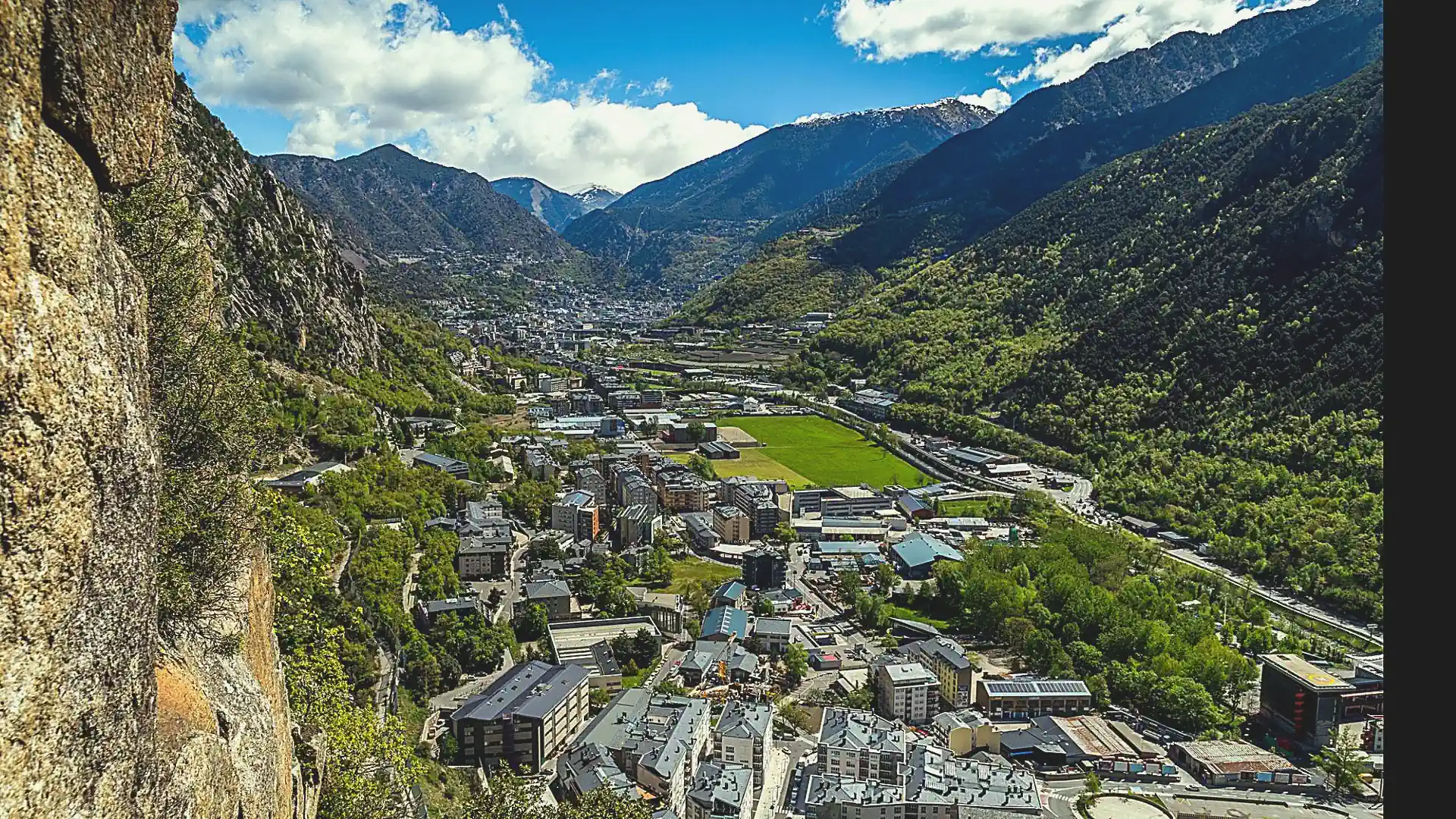 View over Andorra valley with town, roads and Pyrenees mountains